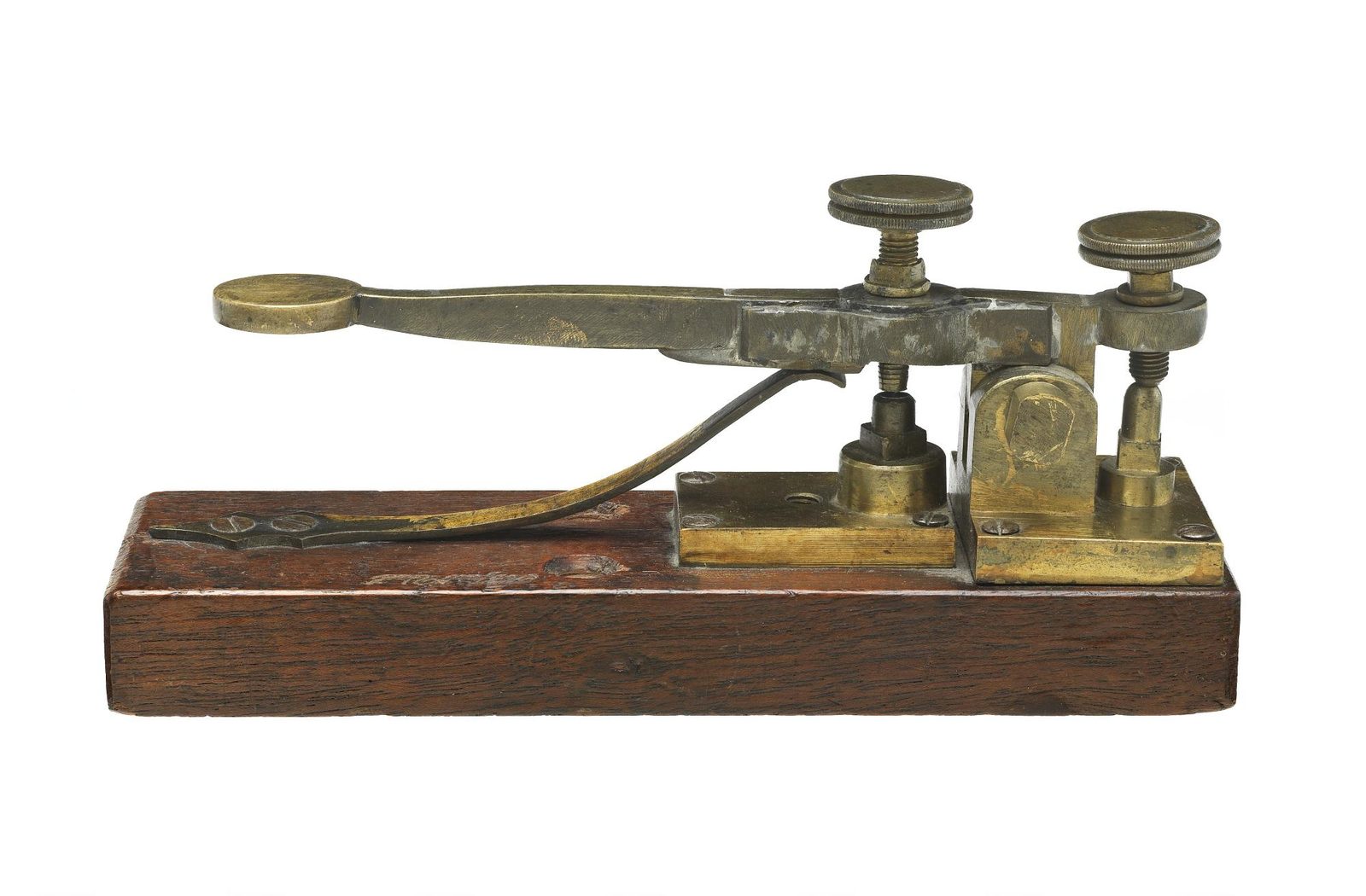 The brass Morse-Vail telegraph key of 1844 on a wooden base